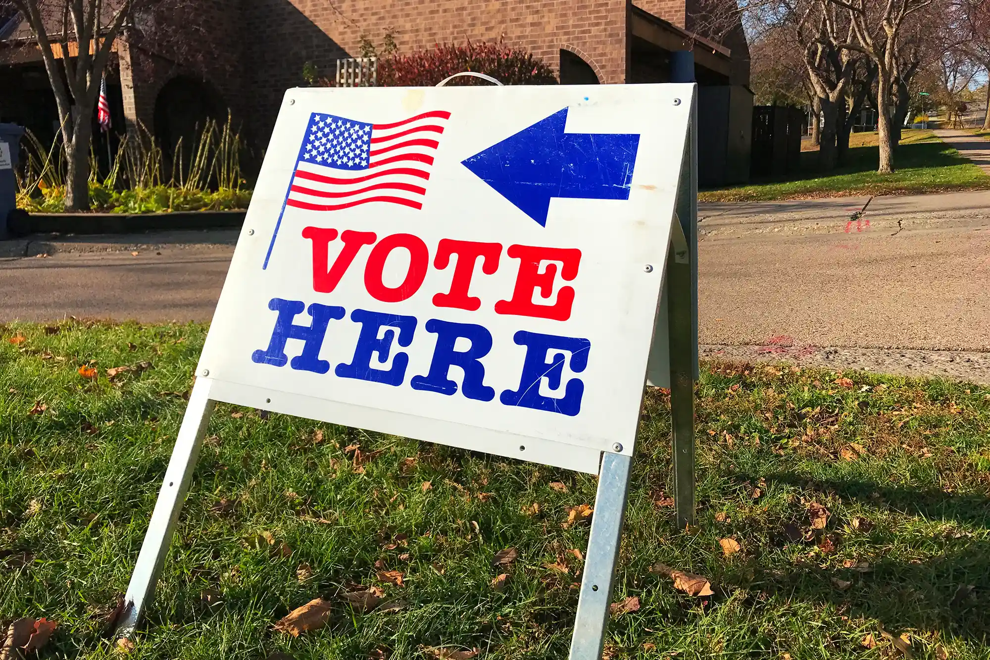 A sign displaying: vote here